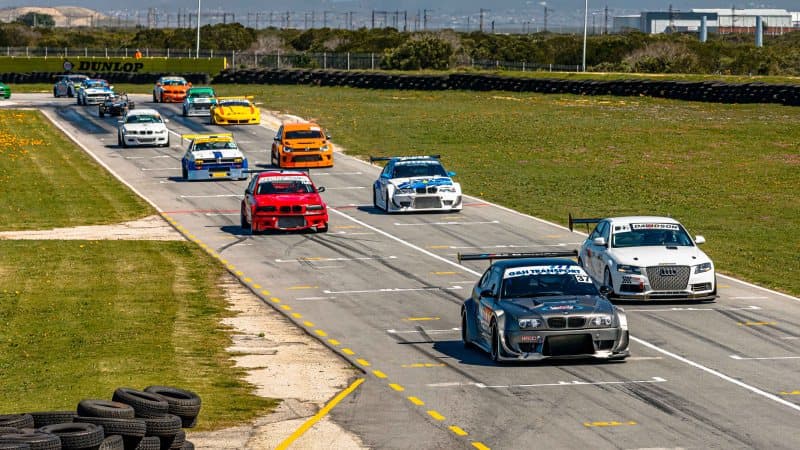 Touring car field led by a BMW M3 on the main straight at Aldo Scribante Raceway during AMSC Regional Round 7