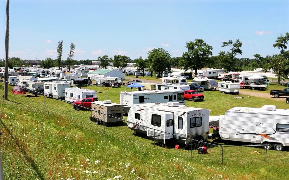 RV and camper trailers parked in the open campground at Brainerd International Raceway, Minnesota