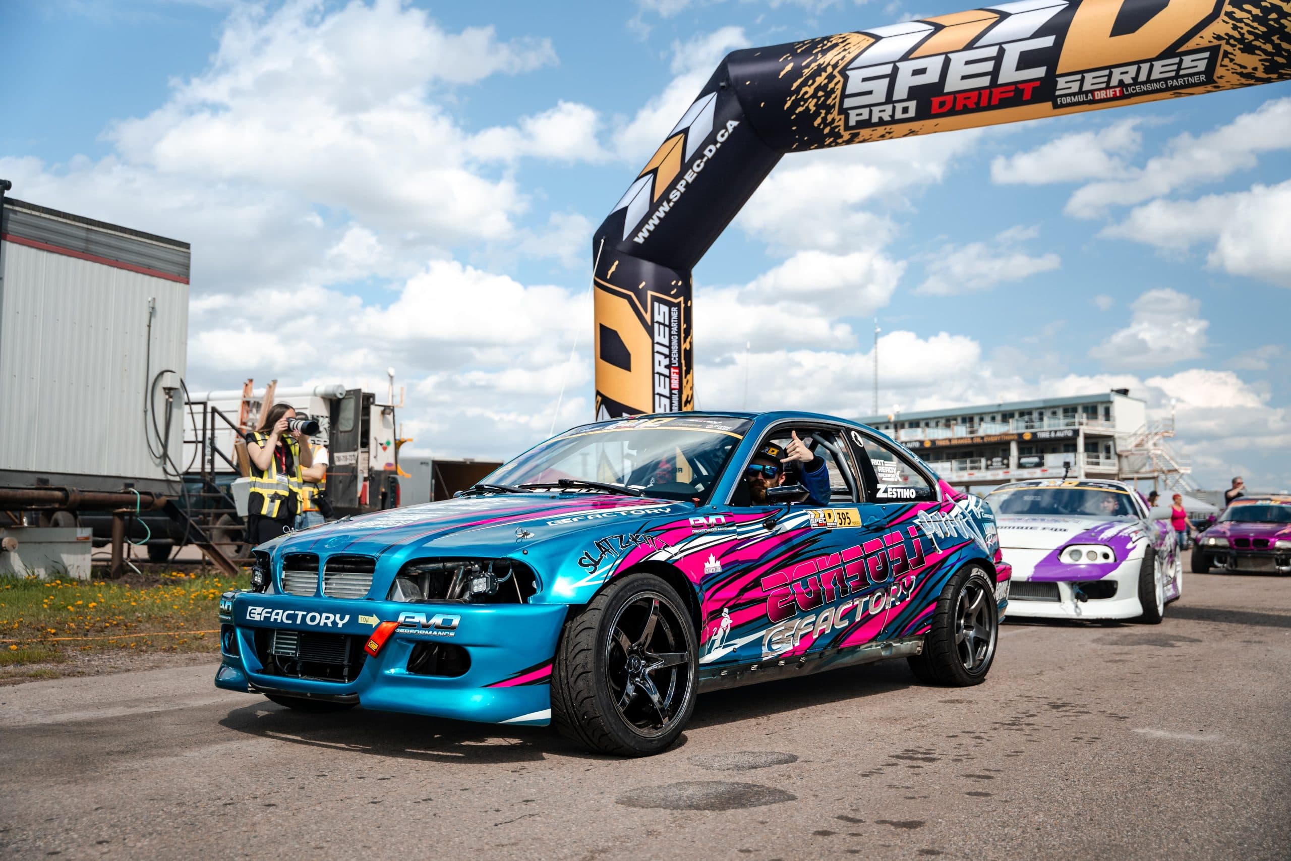 A teal drift car staged beneath the Spec-D Pro Drift arch at RAD Torque Raceway