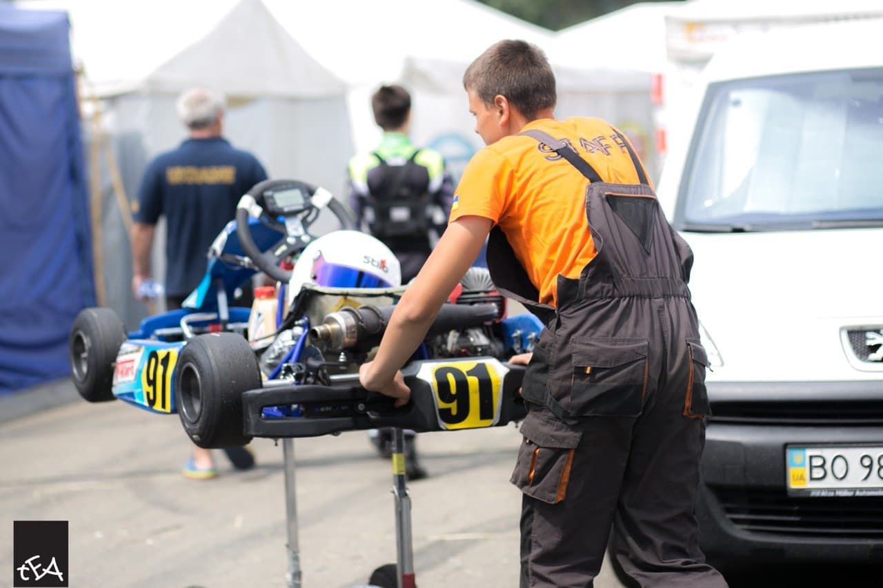 Staff member preps a shifter kart in the paddock at Avtodrom Chaika, Ukraine