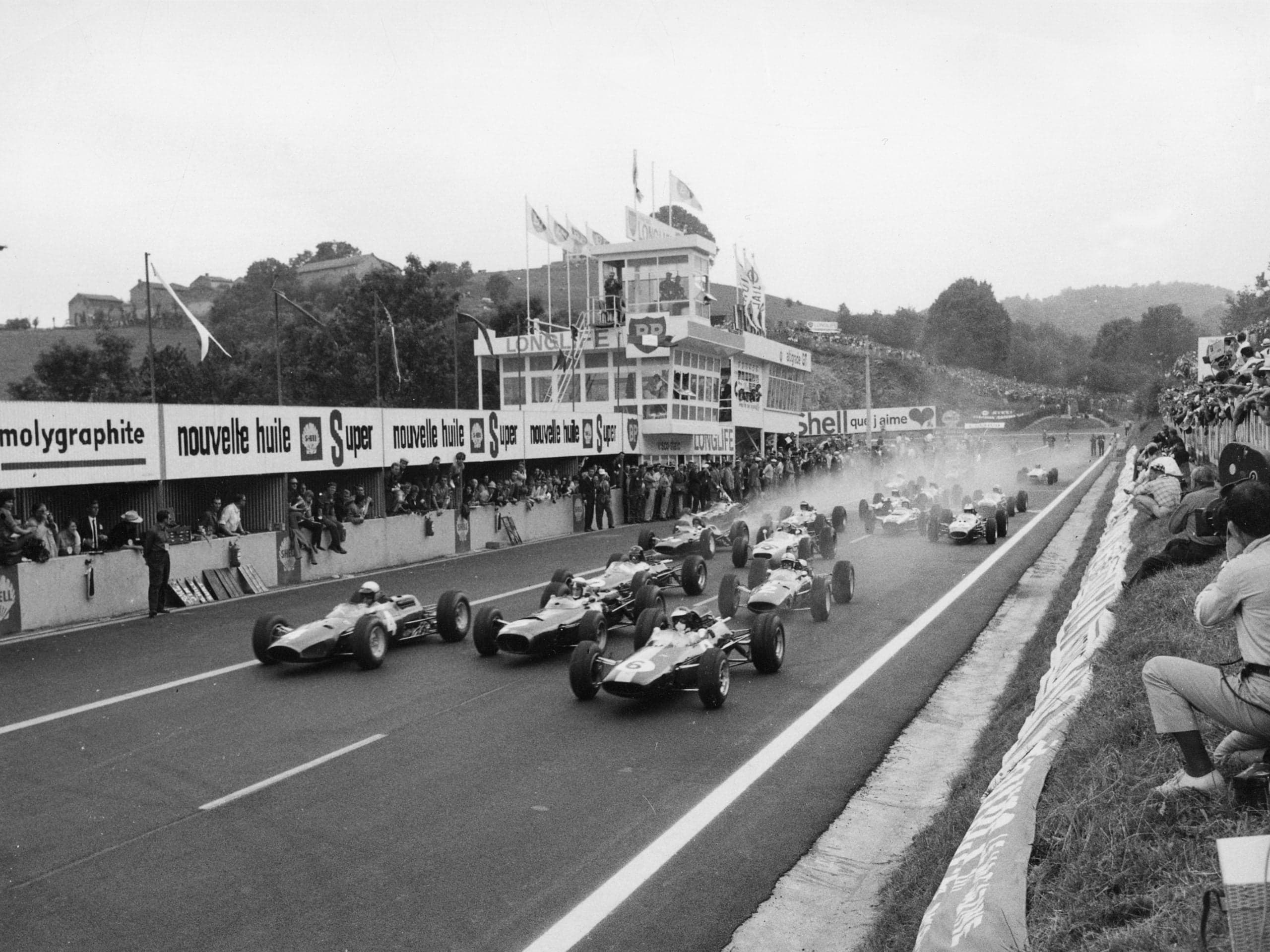 Formula cars take the start of the 1965 French Grand Prix on the old Charade circuit