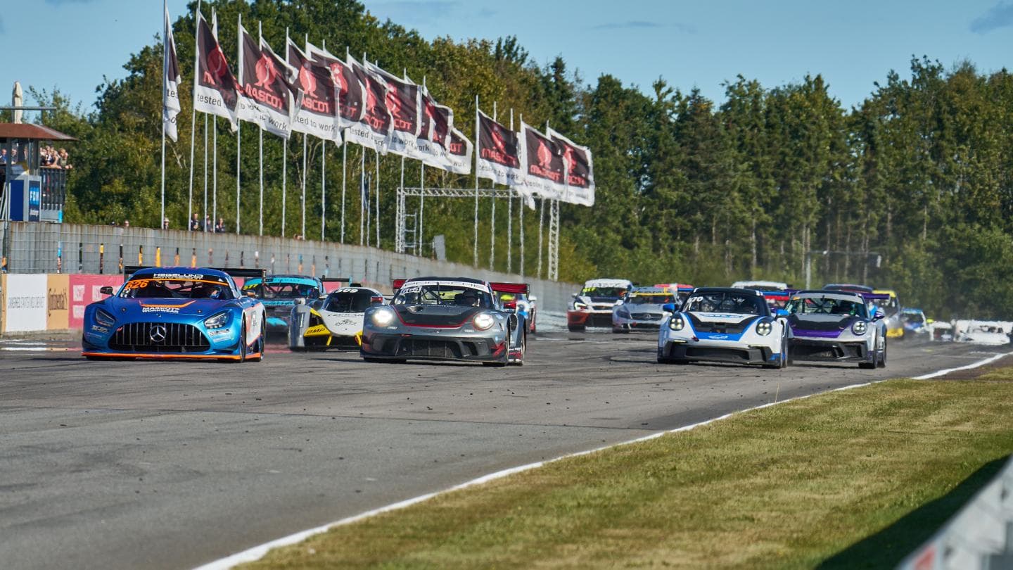 GT3 and touring cars racing side-by-side at the start of a race at FDM Jyllandsringen, Silkeborg