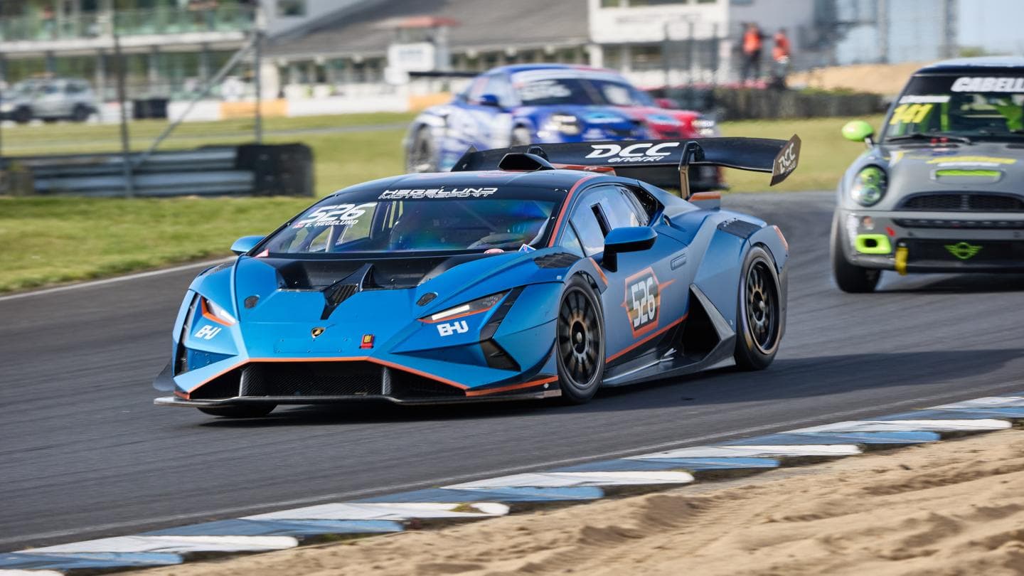 Blue Lamborghini Huracán Super Trofeo number 526 exits a corner at FDM Jyllandsringen, Silkeborg, Denmark