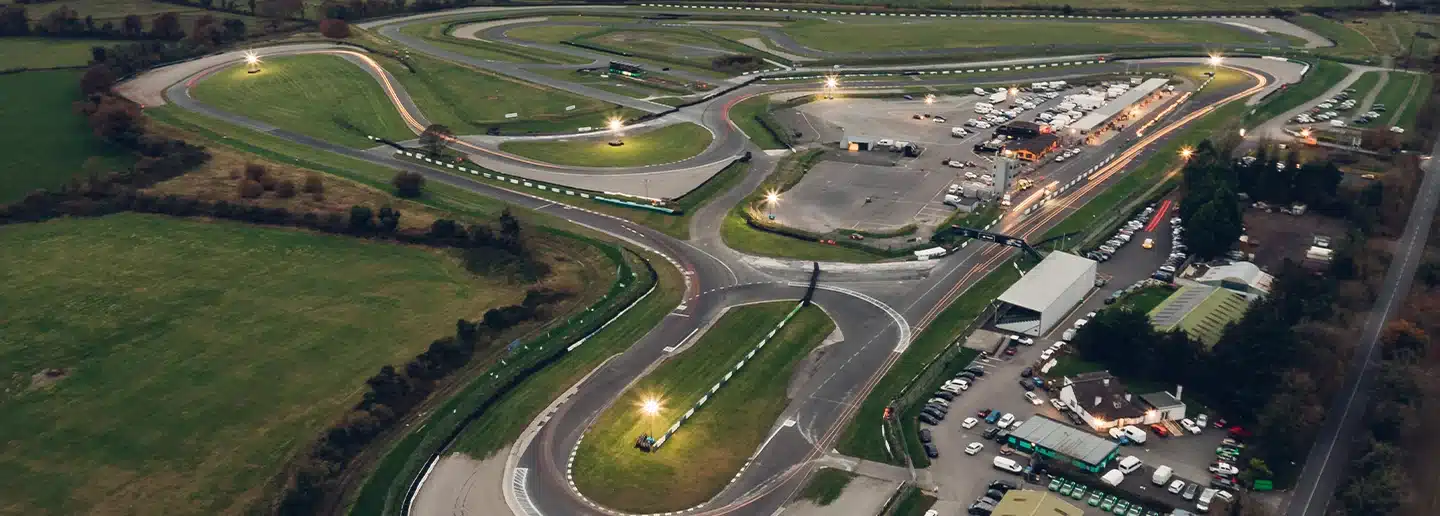 Dusk aerial view of Mondello Park road circuit illuminated by floodlights, County Kildare