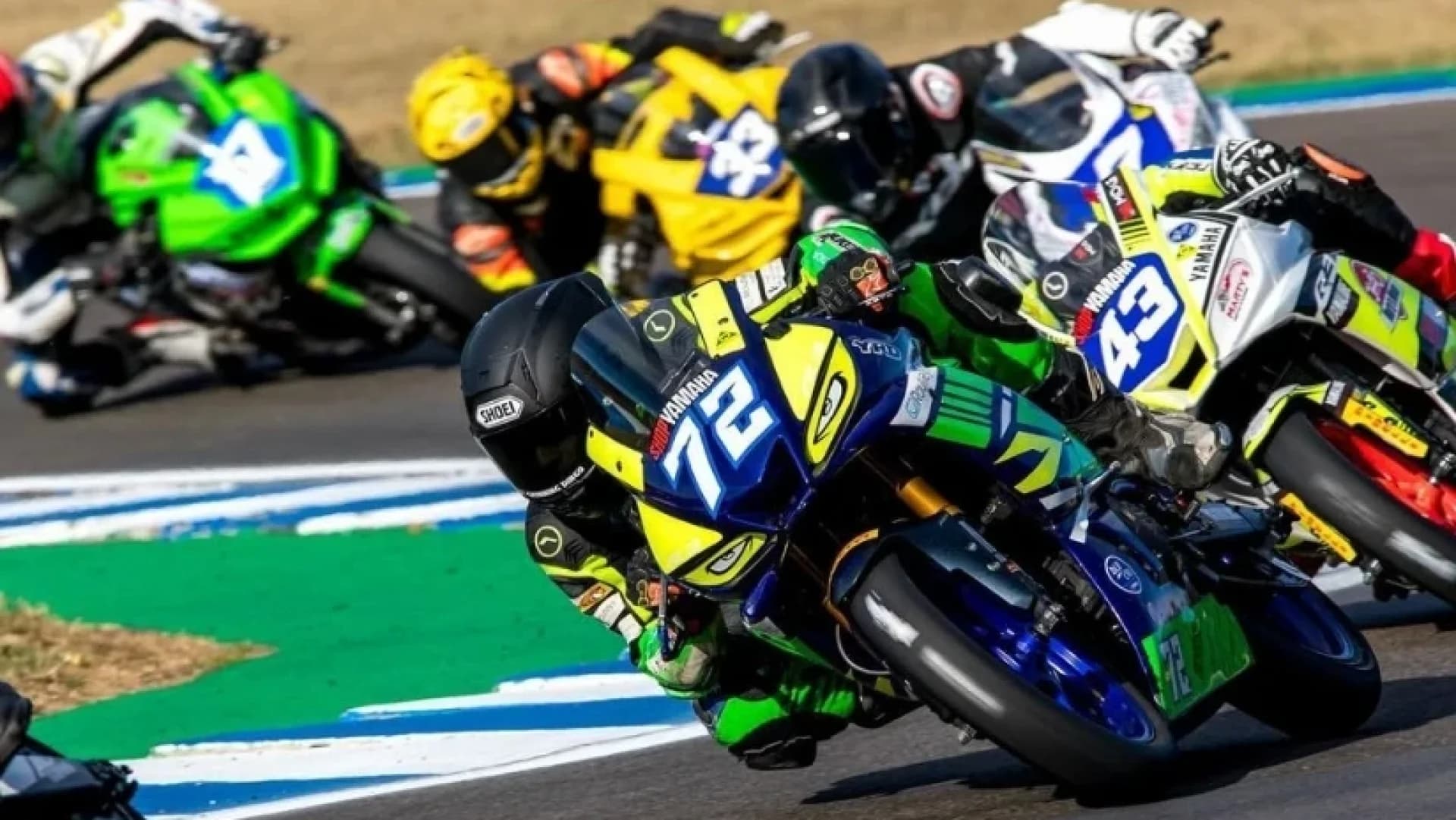 Superbikes racing through a tight corner at Morgan Park Raceway, Warwick, Queensland